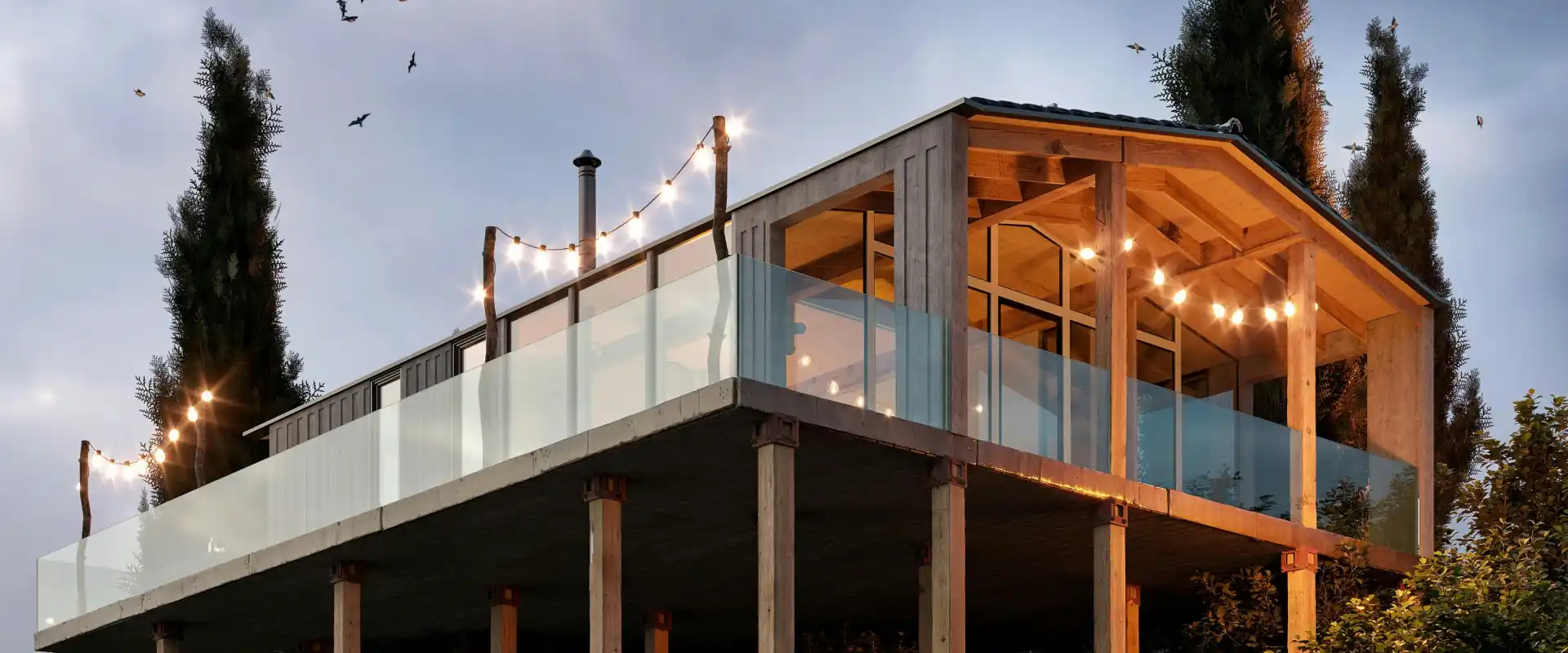 Une maison bois sur pilotis, construite par les équipes Trähus. Elle possède de larges baies vitrées et de magnifiques lumières décoratives.